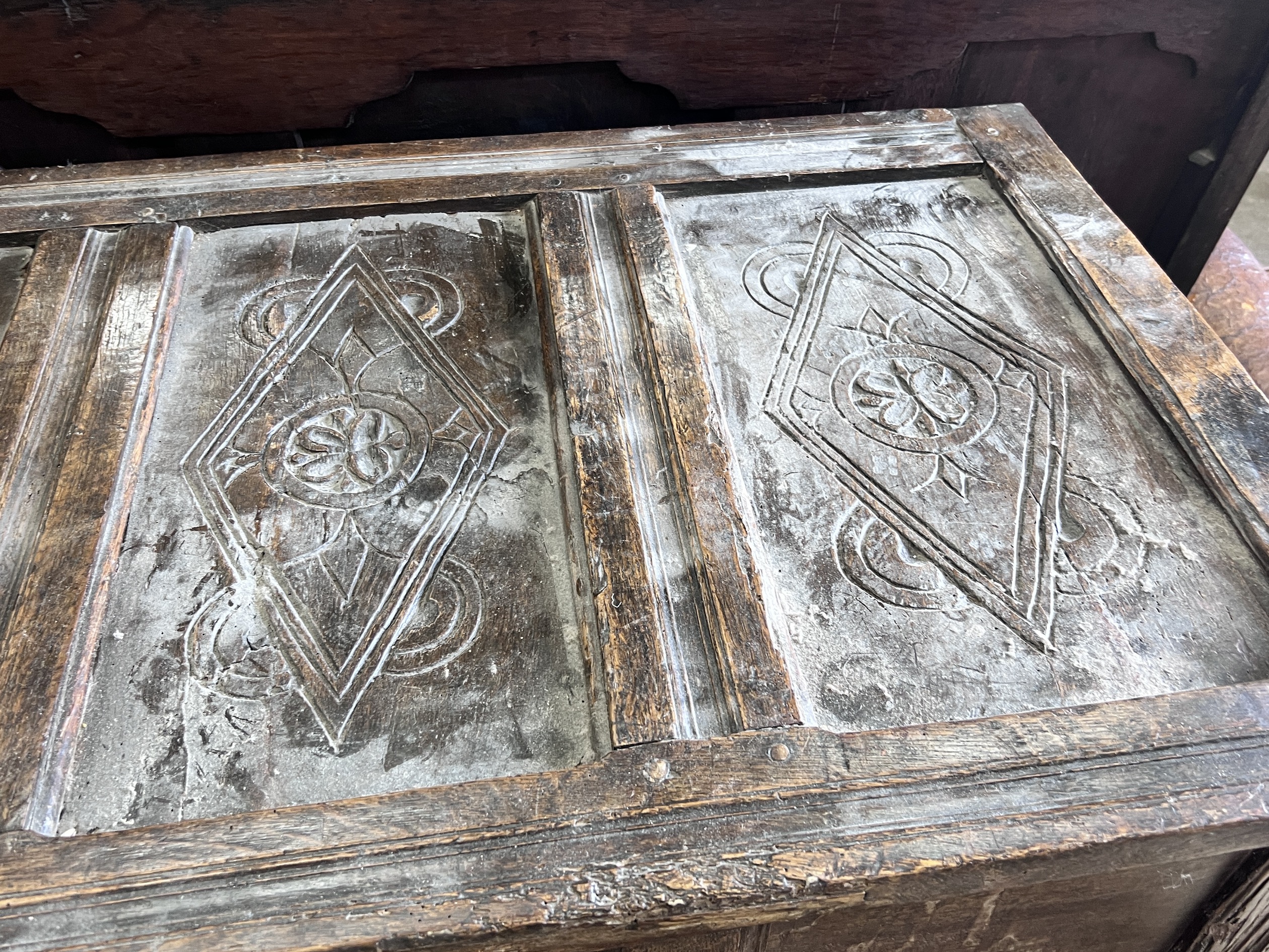 An 18th century panelled oak coffer, length 140cm, depth 61cm, height 92cm